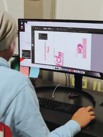 Person Working On A Computer Designing A Logo