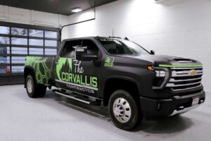 Commercial pickup with black and green full vehicle wrap