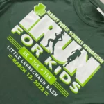 Green t-shirt with an I Run For Kids graphic