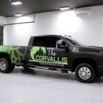 Grey and green commercial pickup truck with custom vinyl vehicle wrap